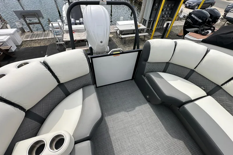 Slide: The Image of 2024 Veranda VP Tower 25 RCT pontoon boat interior with plush seating and cup holders. - 23