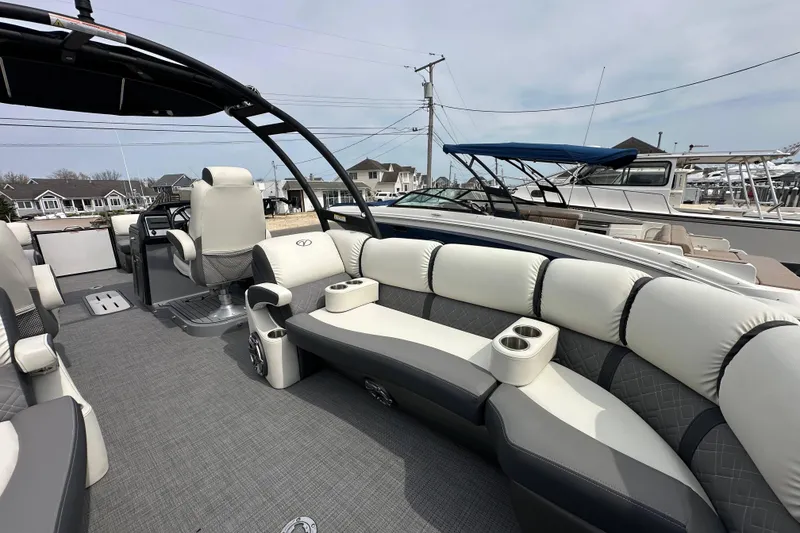 Slide: The Image of Luxurious 2024 Veranda VP Tower 25 RCT pontoon boat interior with plush seating and modern design. - 24