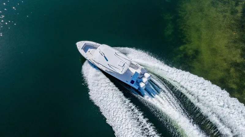 Slide: The Image of Aerial view of a 2019 Everglades 355 Center Console boat on water. - 13
