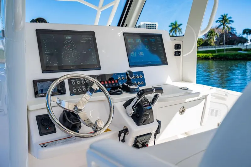 Slide: The Image of 2019 Everglades 355 Center Console helm with modern displays. - 21