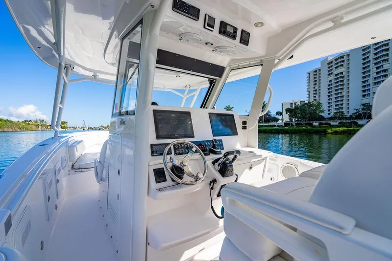 Slide: The Image of 2019 Everglades 355 Center Console boat on calm water. - 22