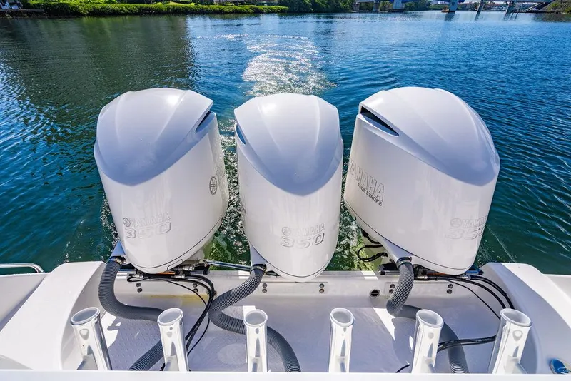 Slide: The Image of Three outboard engines on a 2019 Everglades 355 Center Console boat. - 25