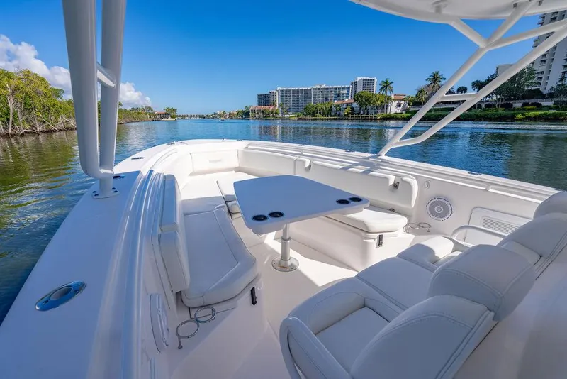 Slide: The Image of Everglades 355 Center Console 2019 on calm waters with luxurious interior. - 26