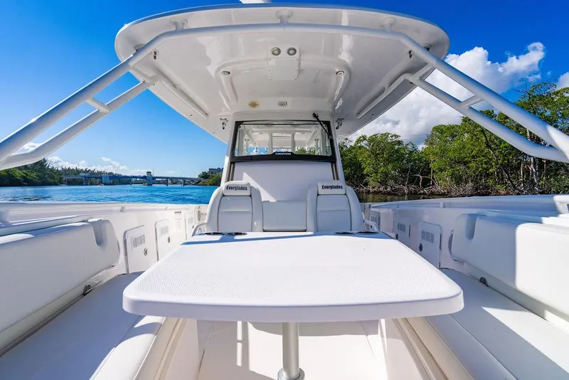 Slide: The Image of Everglades 355 Center Console 2019 on calm waters with blue sky. - 29