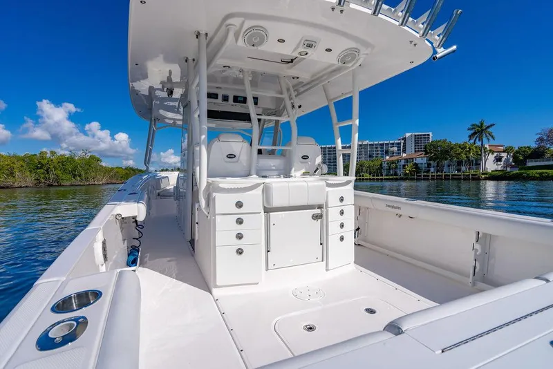 Slide: The Image of 2019 Everglades 355 Center Console boat on calm water, modern design. - 37