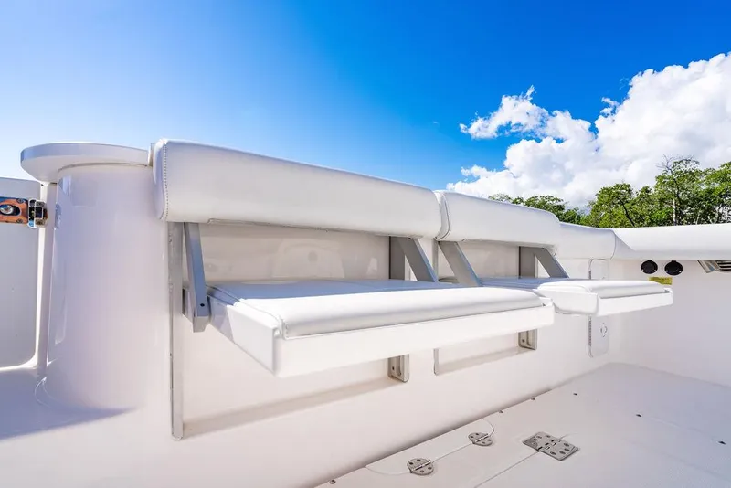 Slide: The Image of Everglades 355 Center Console 2019 with white seating and blue sky. - 40