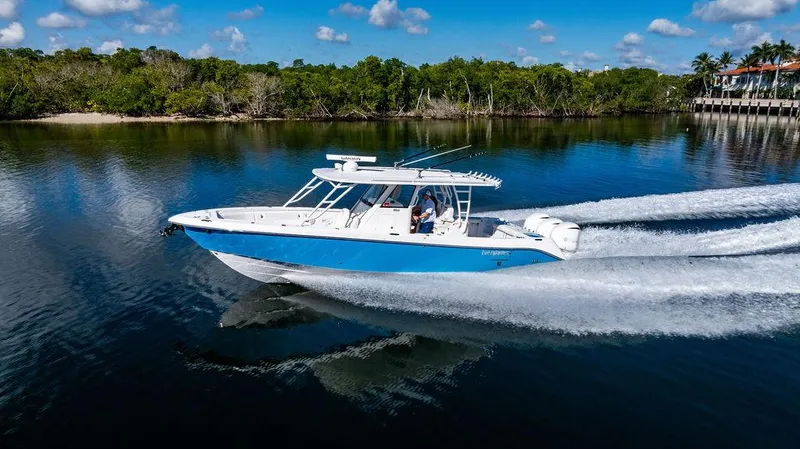 Slide: The Image of 2019 Everglades 355 Center Console cruising on calm water. - 5