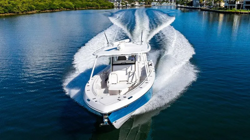 Slide: The Image of 2019 Everglades 355 Center Console cruising on calm water. - 6