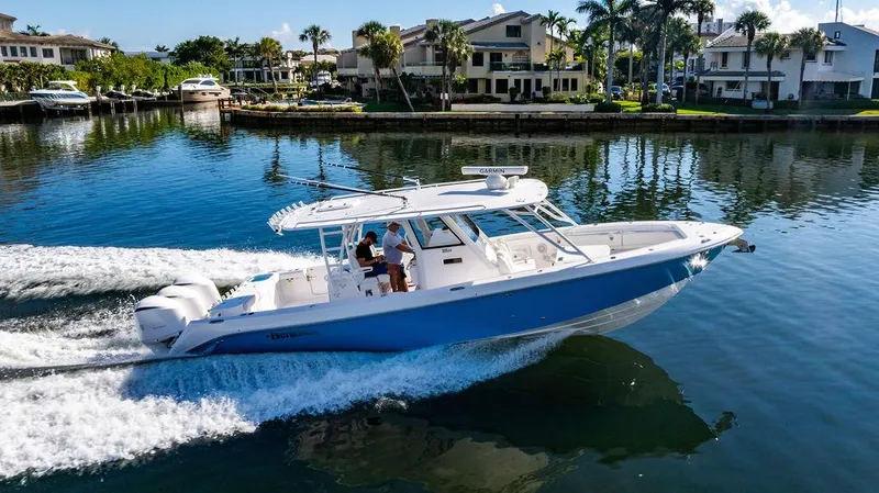 Slide: The Image of 2019 Everglades 355 Center Console cruising on calm waters. - 7