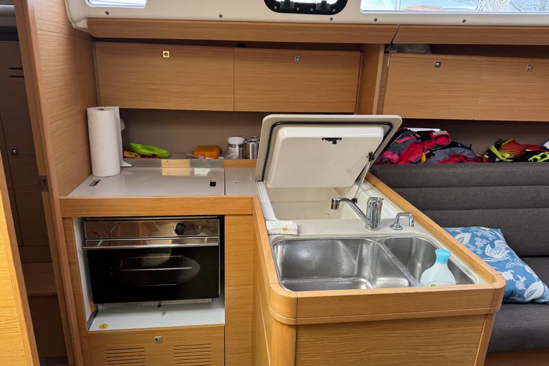 Slide: The Image of Interior of 2017 Dufour 350 Grand Large yacht kitchen with sink and oven. - 10