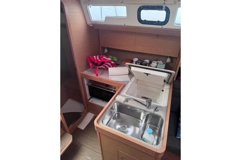 Slide: The Image of 2017 Dufour 350 Grand Large yacht kitchen with sink, storage, and window. - 11