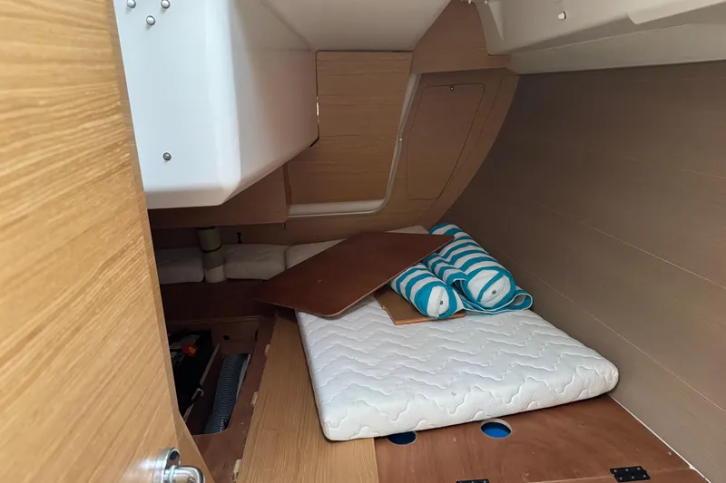 Slide: The Image of Interior cabin of 2017 Dufour 350 Grand Large yacht with mattress and striped cushions. - 12