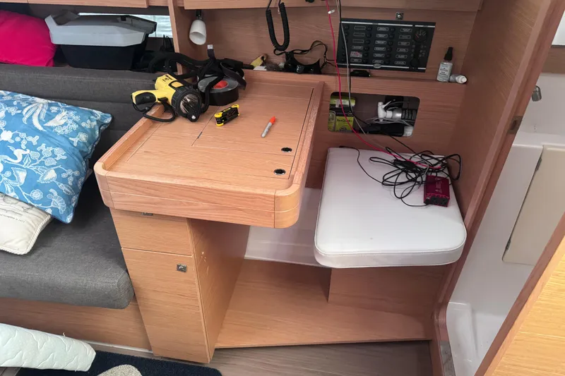 Slide: The Image of Interior of 2017 Dufour 350 Grand Large yacht with navigation station and seating. - 14