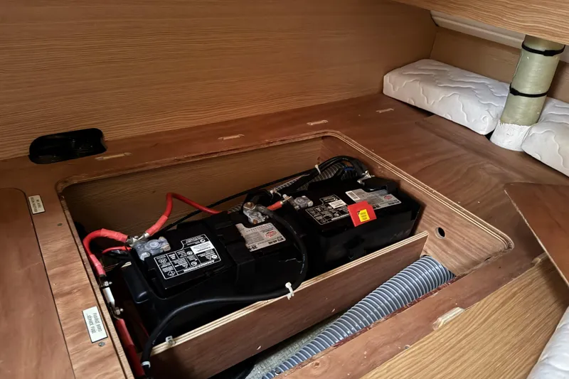 Slide: The Image of Battery compartment of 2017 Dufour 350 Grand Large sailboat, showcasing dual batteries. - 19