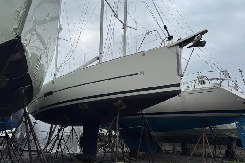 Slide: The Image of 2017 Dufour 350 Grand Large sailboat on stands in a boatyard. - 20