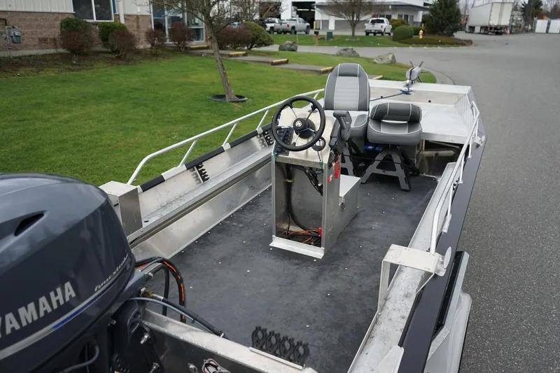 Slide: The Image of 2021 Wooldridge 16 Alaskan LT boat with Yamaha motor, featuring steering console and seating. - 5