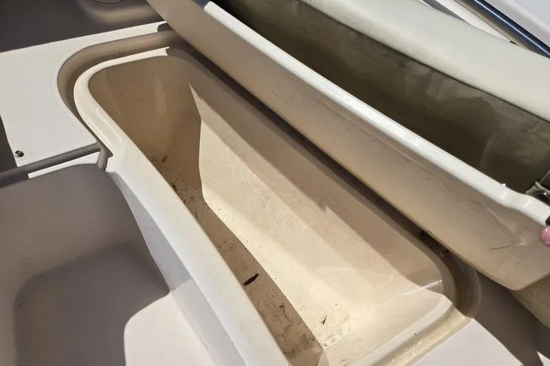 Slide: The Image of Open storage compartment on a 2007 Grady-White Tournament 205 boat. - 14