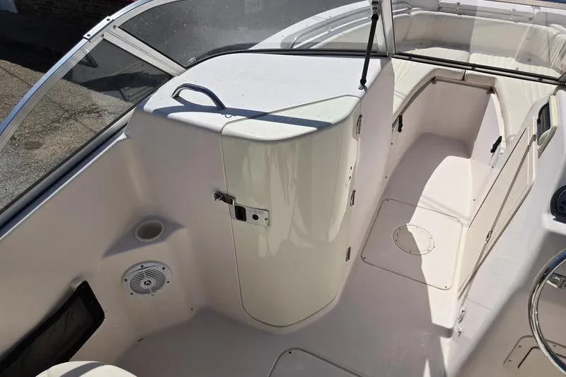 Slide: The Image of 2007 Grady-White Tournament 205 boat interior with seating and storage compartments. - 20