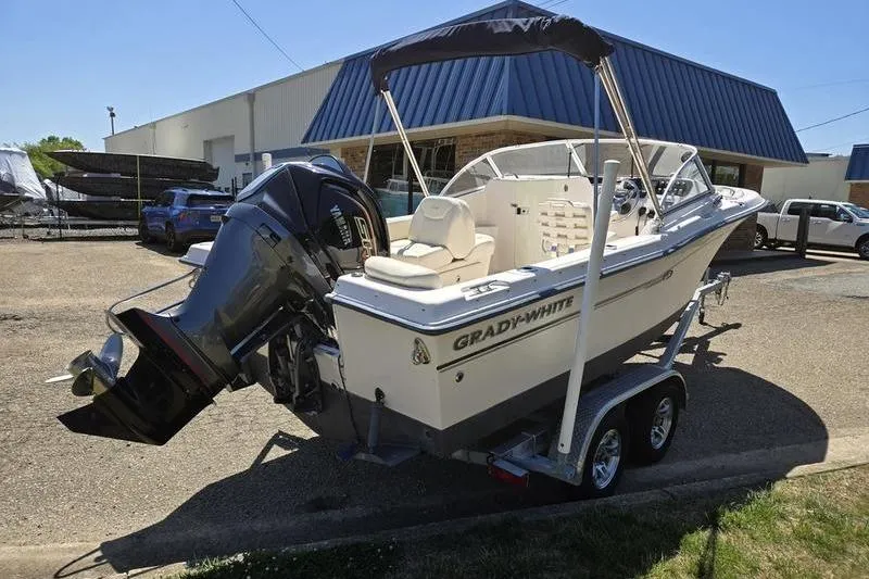 Slide: The Image of 2007 Grady-White Tournament 205 boat on trailer, parked outside a building. - 4