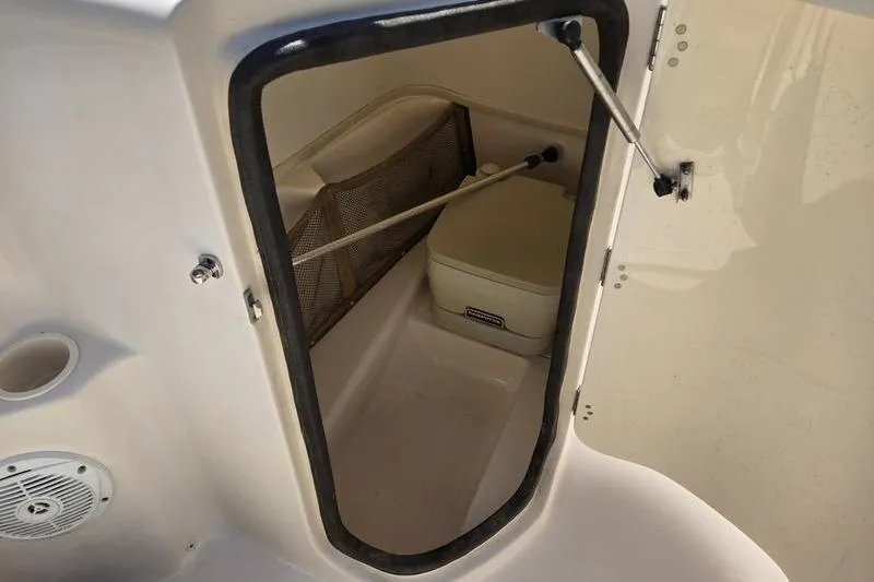 Slide: The Image of 2007 Grady-White Tournament 205 boat storage compartment with portable toilet. - 5