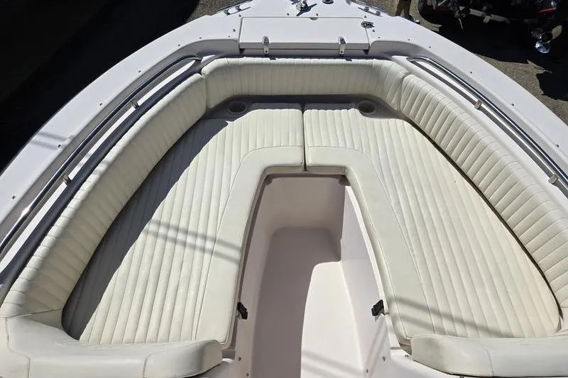 Slide: The Image of 2007 Grady-White Tournament 205 boat interior with white cushioned seating. - 8