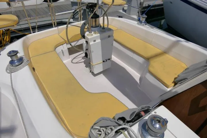 Slide: The Image of Cockpit of 2001 Catalina 310 sailboat with yellow seating and steering wheel. - 24
