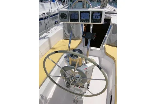Slide: The Image of Cockpit of 2001 Catalina 310 sailboat with steering wheel and navigation instruments. - 33