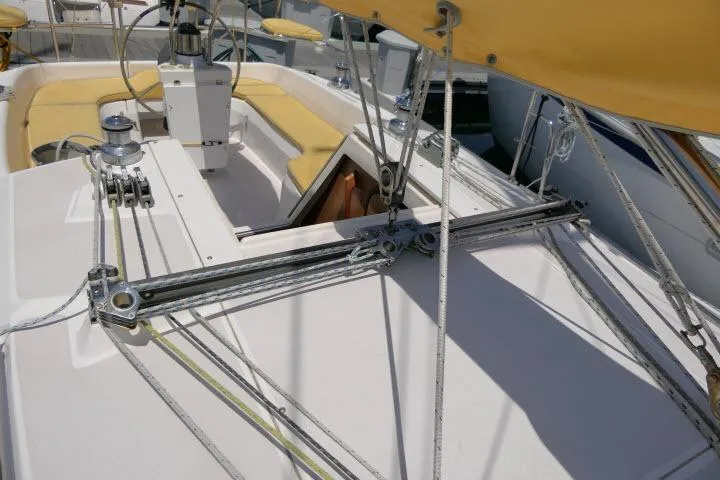 Slide: The Image of 2001 Catalina 310 sailboat deck with rigging and yellow seating. - 34