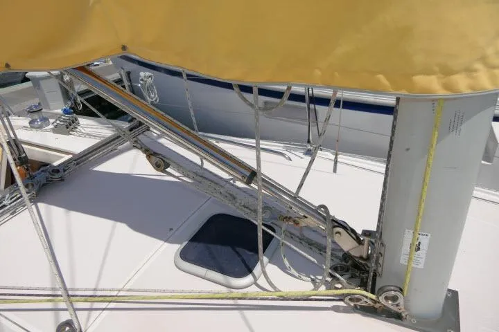 Slide: The Image of Deck view of a 2001 Catalina 310 sailboat with rigging and yellow sail cover. - 35