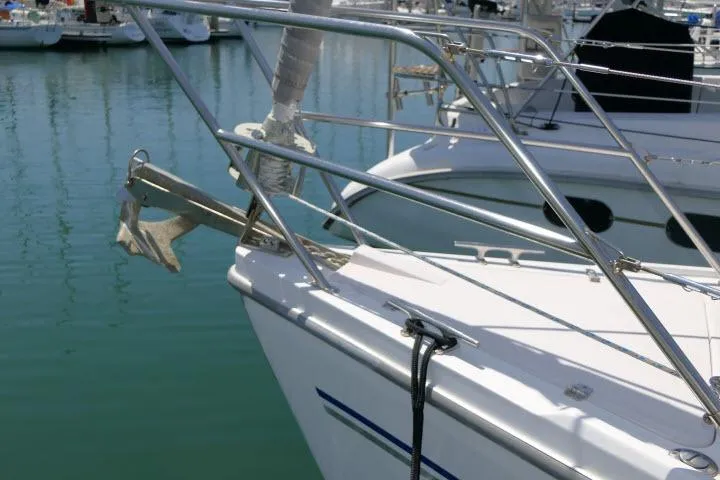 Slide: The Image of Bow of a 2001 Catalina 310 sailboat docked in a marina. - 39