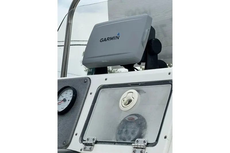 Slide: The Image of Garmin GPS on 2013 NauticStar 210 Coastal boat dashboard with gauge and compartment. - 5