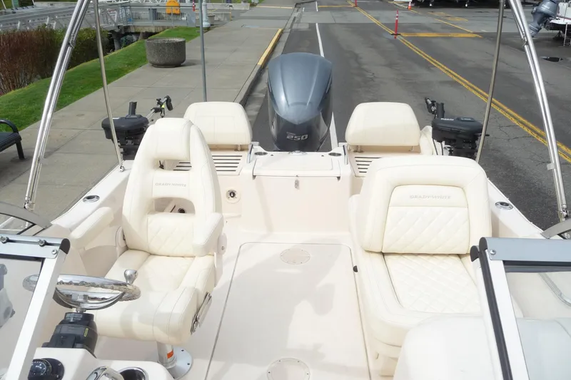 Slide: The Image of 2021 Grady-White Freedom 215 boat interior with seating and steering wheel. - 10