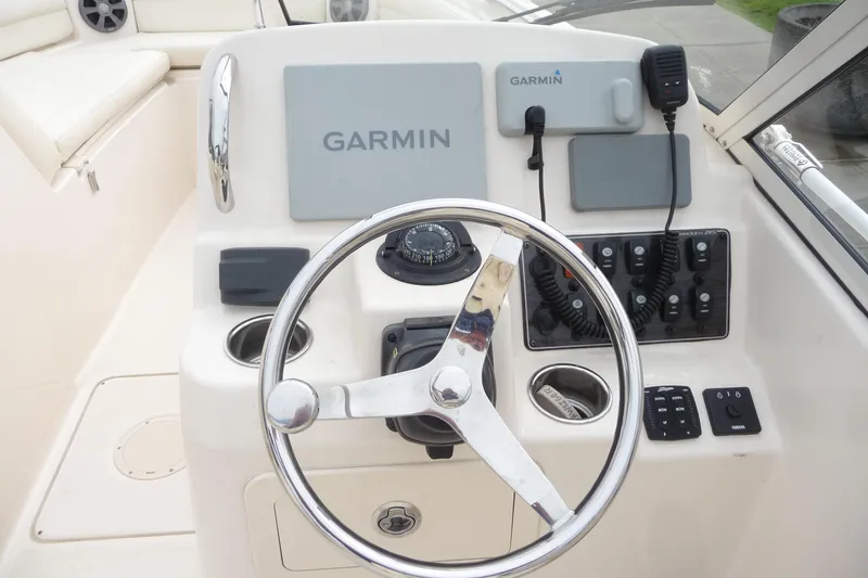 Slide: The Image of Grady-White Freedom 215 boat dashboard with Garmin navigation system, 2021 model. - 14