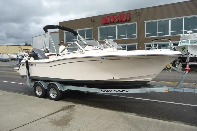 Slide: The Image of 2021 Grady-White Freedom 215 boat on trailer outside Bayside dealership. - 3