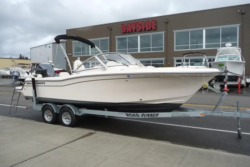 Slide: The Image of 2021 Grady-White Freedom 215 boat on trailer outside Bayside dealership. - 4