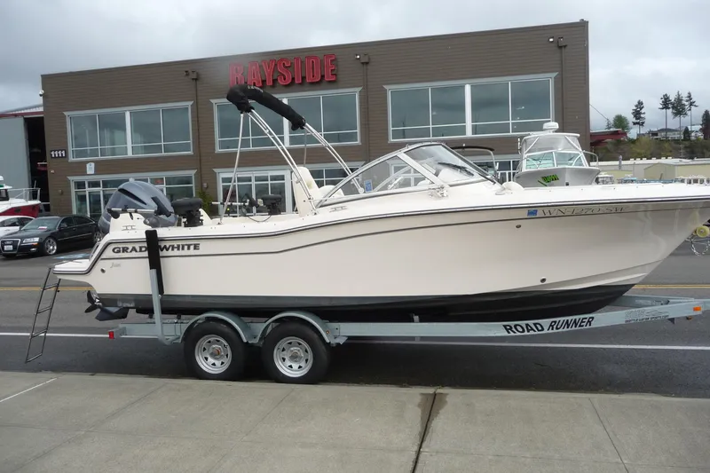 Slide: The Image of 2021 Grady-White Freedom 215 boat on trailer outside dealership. - 7