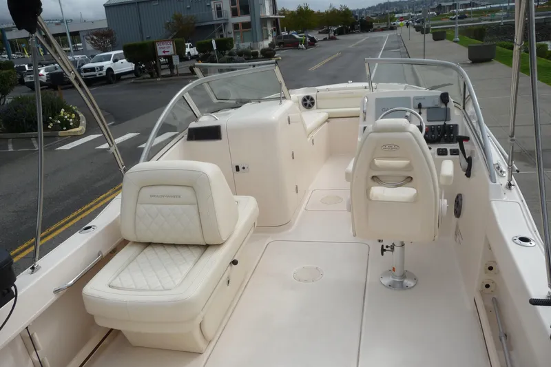 Slide: The Image of 2021 Grady-White Freedom 215 boat interior with seating and control panel. - 9
