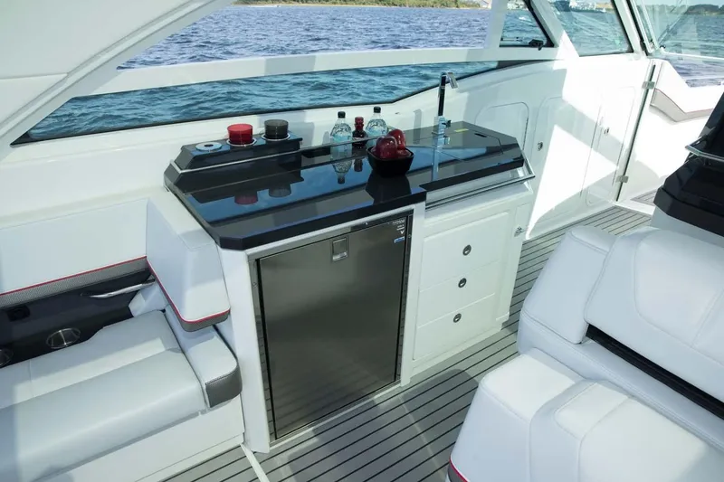 Slide: The Image of Manufacturer Provided Image: 2019 Formula 430 Super Sport Crossover yacht interior with kitchenette and seating. - 11