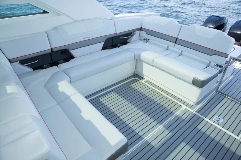 Slide: The Image of Manufacturer Provided Image: 2019 Formula 430 Super Sport Crossover boat interior with white seating and ocean view. - 14