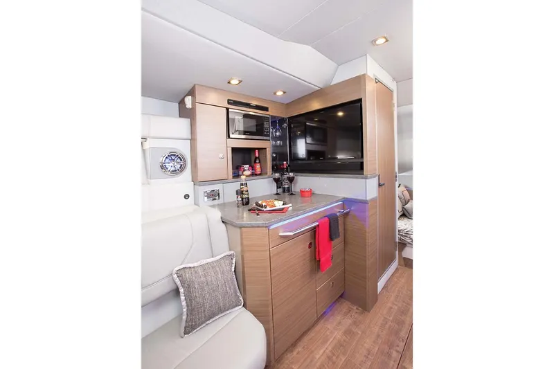 Slide: The Image of Manufacturer Provided Image: 2019 Formula 430 Super Sport Crossover interior kitchen with modern amenities. - 21