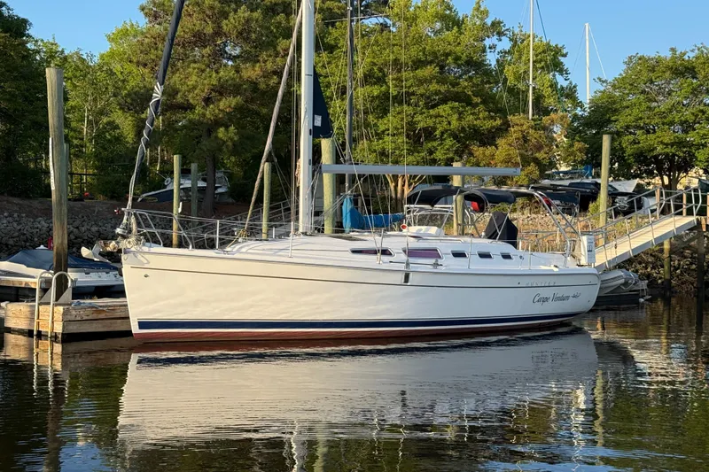 The Image of Sailboat docked in marina, 2009 Hunter 38 model, surrounded by trees. - 0