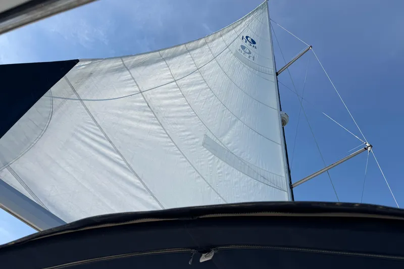 Slide: The Image of Sail of a 2009 Hunter 38 yacht against a clear blue sky. - 29