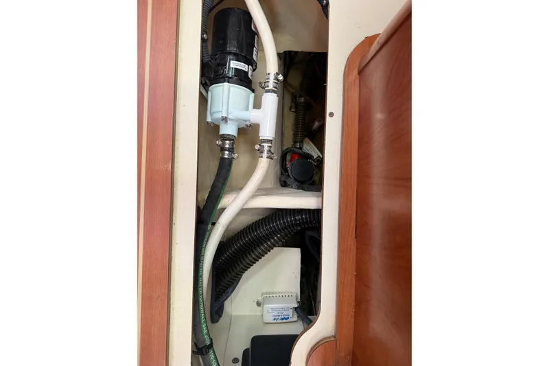 Slide: The Image of Interior view of a 2009 Hunter 38 yacht showing plumbing and electrical components. - 31