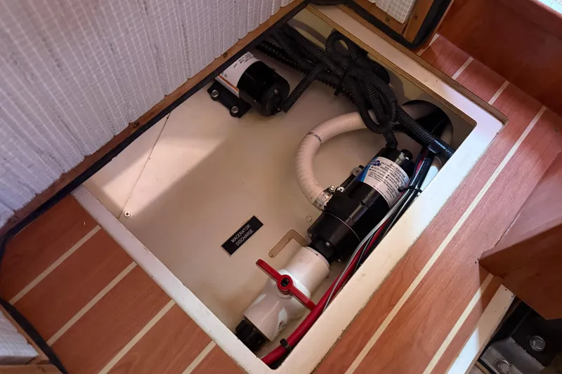 Slide: The Image of Bilge compartment of 2009 Hunter 38 sailboat with macerator discharge system. - 33