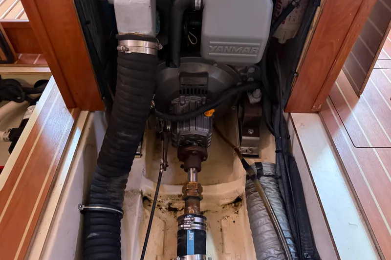 Slide: The Image of Engine compartment of a 2009 Hunter 38 sailboat featuring a Yanmar engine. - 34