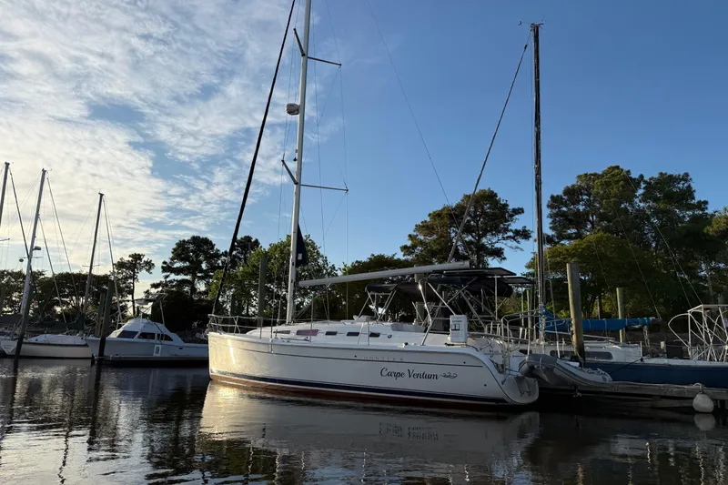 Slide: The Image of Sailboat docked at marina, Hunter 38 model, 2009, under a clear blue sky. - 5