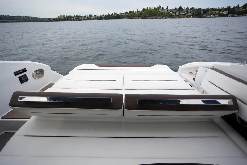 Slide: The Image of 2019 Cobalt A36 boat with luxurious seating on a serene lake. - 10