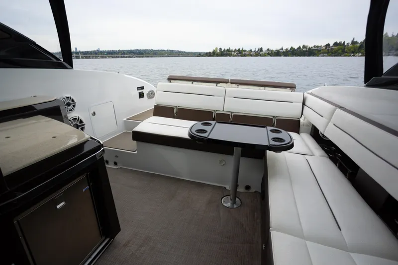 Slide: The Image of Luxurious seating area on a 2019 Cobalt A36 boat with lake view. - 11
