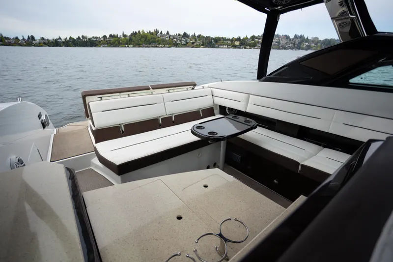 Slide: The Image of Luxurious seating area on a 2019 Cobalt A36 boat with scenic lake view. - 12