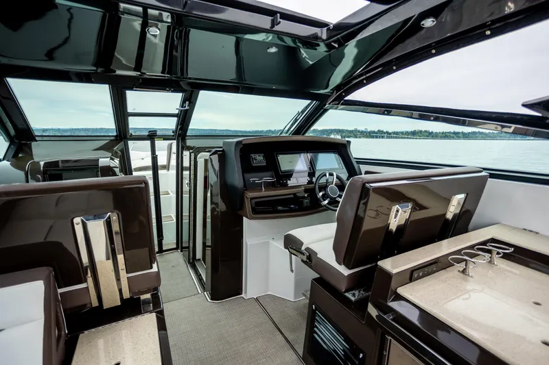 Slide: The Image of Interior of a 2019 Cobalt A36 boat with modern helm and seating. - 14
